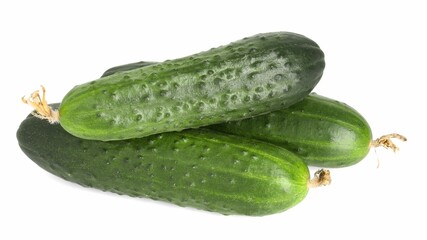 Three fresh green cucumbers isolated on white, above view