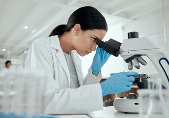 Woman, microscope and science in lab for chemistry, observation and experiment results. Scientist,...