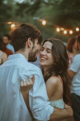 A pair of friends embracing at a social gathering