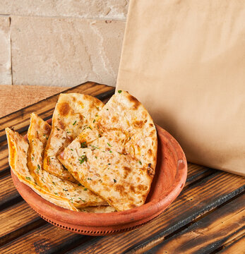 paneer parantha in a bowl with food delivery packaging