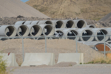 collection of concrete drainage pipes at a factory