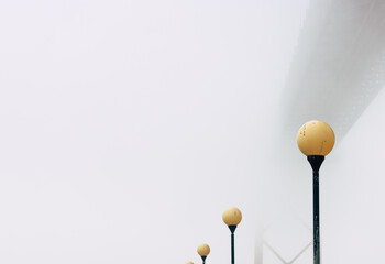 Lisbon Bridge, in the middle of the fog, with some lamps