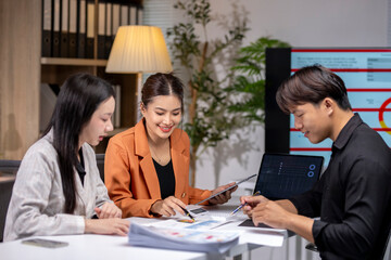 Asian business people having meeting using laptop computer and digital tablet at office