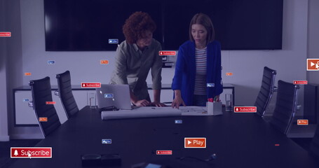 Image of social media icons with texts over diverse colleagues discussing work in office