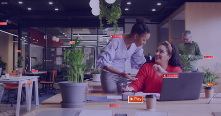 Image of social media icons with texts over diverse colleagues discussing work in office