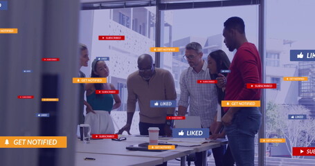 Image of social media icons with texts over diverse colleagues having meeting in office