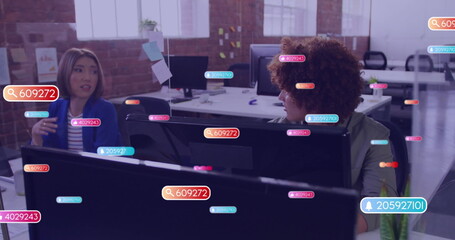 Image of social media icons with numbers over diverse colleagues discussing work in office