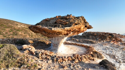 Aerial drone photo of famous stone mushroom, a rare geological phenomenon which the people of the island of Kimolos call “Skiadi", Cyclades, Greece