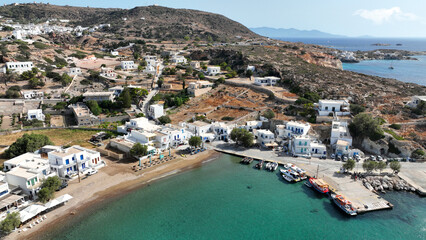 Fototapeta premium Aerial drone photo small port of Psathi untouched by tourism built below picturesque hora of Kimolos island, Cyclades, Greece