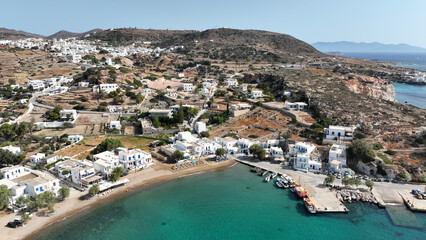Aerial drone photo small port of Psathi untouched by tourism built below picturesque hora of Kimolos island, Cyclades, Greece