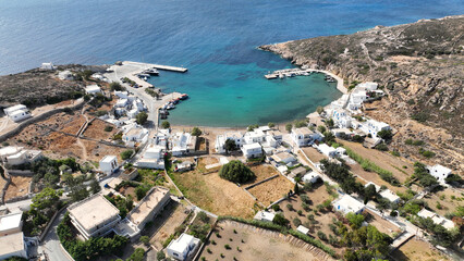 Fototapeta premium Aerial drone photo small port of Psathi untouched by tourism built below picturesque hora of Kimolos island, Cyclades, Greece