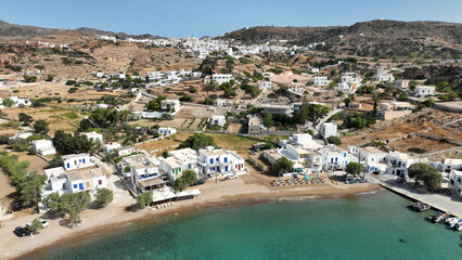 Obraz premium Aerial drone photo small port of Psathi untouched by tourism built below picturesque hora of Kimolos island, Cyclades, Greece