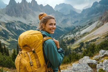 Naklejka premium A smiling female traveler with a yellow hiking backpack enjoys the beautiful scenery of the majestic mountains. Travel, adventure. Concept of an active lifestyle, ai