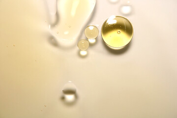 Drops of oil are on the surface of the water.