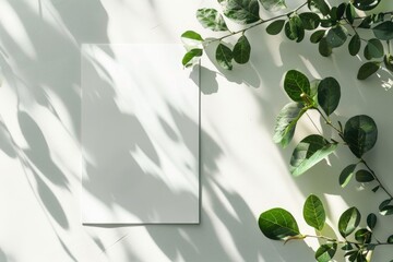 Serene Shadows: Blank Paper Canvas Surrounded by Natural Leaf Silhouettes