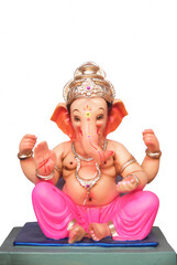 Ganesha Idol. Hindu God Ganesha on white background, Ganesh festival. Pune, Maharashtra, India. copy space, cover, background.