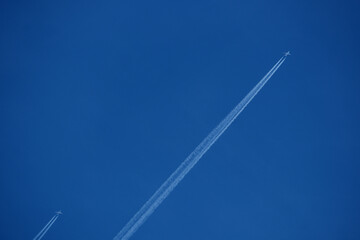 contrails in the blue sky. Airplanes in the blue sky. 