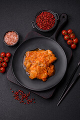 Sliced fish in tomato sauce with salt and spices