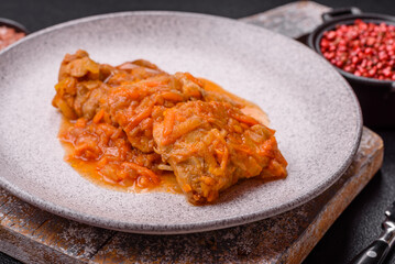 Sliced fish in tomato sauce with salt and spices