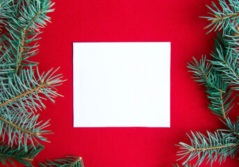 Christmas decorations on red background, flat lay. Space for text.