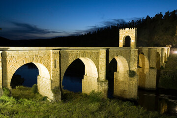 Roman Bridge of Alcántara at Twilight Over the Tagus River in Spain