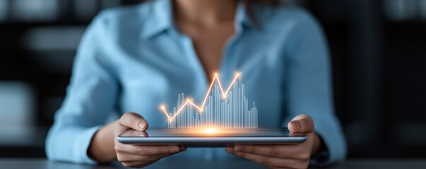 Close up of happy female using tablet with glowing data visualization, showcasing growth and analytics. scene reflects modern technology and digital engagement