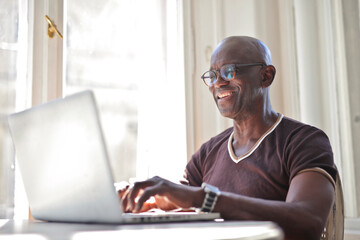 adult man works in a computer at home