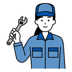 モンキーレンチを持つつなぎ作業服の女性