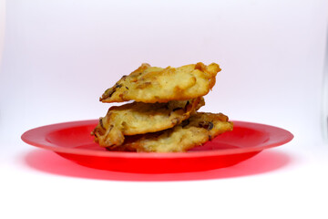 fried bakwan food served on a red plate