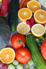 Various seasonal fruits and vegetables on white background. Summer and fall produce. Selective focus.