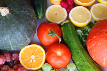 Various seasonal fruits and vegetables on white background. Summer and fall produce. Selective focus.