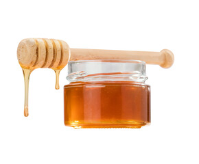Honey glass jar and wooden spoon isolated on white background as package design element