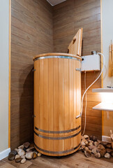 In the corner of a cozy bathroom, there is a wooden barrel casually resting next to a bathtub, adding a rustic touch to the overall decor of the space, creating a unique ambiance