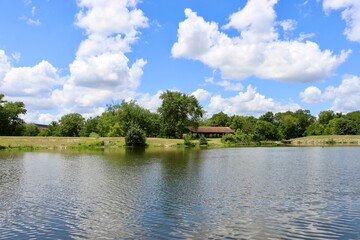 The peaceful lake in the country on a bright sunny day.