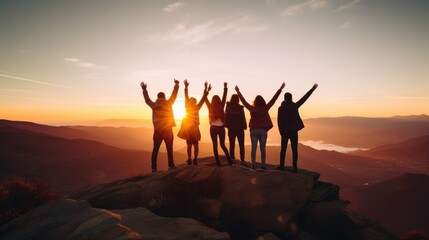 Fototapeta premium A group of friends standing atop a mountain with their arms raised in celebration, embracing the golden sunrise and the breathtaking landscape below.
