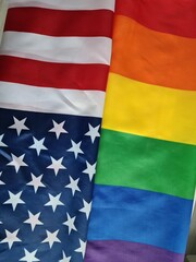Flags of the United States and pride homosexuality displayed side by side in a celebratory atmosphere