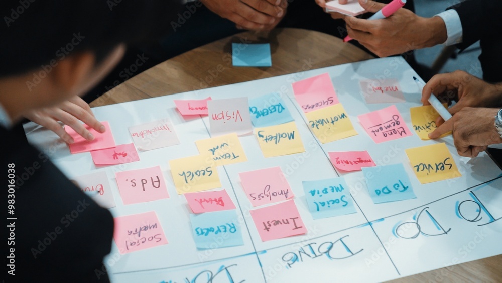 Poster top view of business people hands making scrum task board to manage workflow in workplace. diverse m
