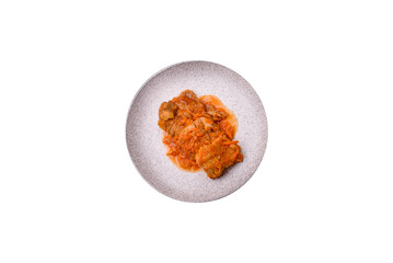 Sliced fish in tomato sauce with salt and spices