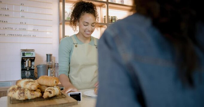 African American Barista taking Contactless Payment  from Customer at  Cafe Counter