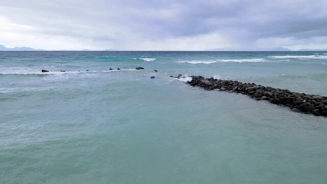 Breakwater Rock Formation Battling Strong Sea Waves