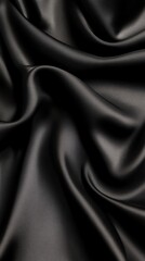 Obraz premium A close-up of luxurious black satin fabric, showcasing its smooth texture and elegant sheen, perfect for fashion and decor.
