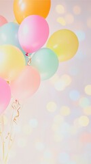 A bouquet of floating balloons in pastel colors.  With bright bokeh background for celebrating birthdays or other holidays, with plenty of empty copy space, for a card, background or backdrop.