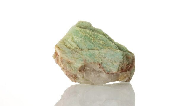 Amazonite mineral stone spinning in a circle on a white background