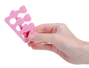 Pedicure separators in hand on a white background isolation