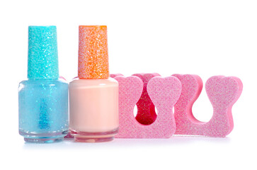 Pedicure separators with nail polish on a white background isolation