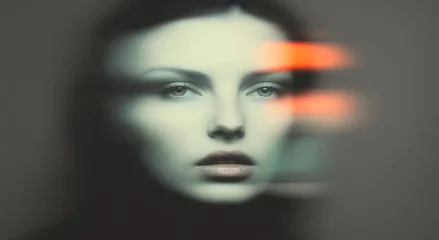 Monochrome portrait of a woman with an orange stripe on her face and glare in the photo. © W.O.W