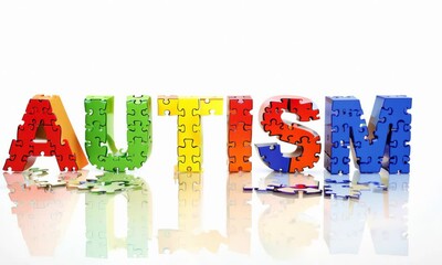 The word Autism is creatively spelled out using colorful puzzle pieces, symbolizing autism awareness, diversity, and neurodiversity advocacy