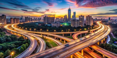 Obraz premium Dynamic Bird's-Eye View of a Modern City Highway Interchange at Dusk, Showcasing Intricate Road Networks, Long Exposure Light Streaks, and Reflective Sunset in Vibrant Colors
