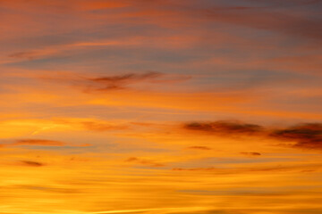 The sky glows with colorful sunset hues, creating a warm and inviting atmosphere. Perfect for adding charm to any project