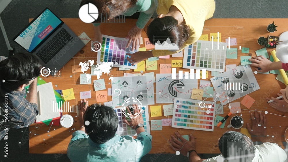 Aufkleber top down view of business team with casual outfit looking laptop screen and sharing idea. aerial vie